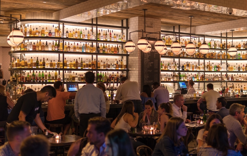 travel, bar counter, bar - drink establishment, market, group, adult, shelf, inside, large group of people, wine, drink, gathering, food and drink, illuminated