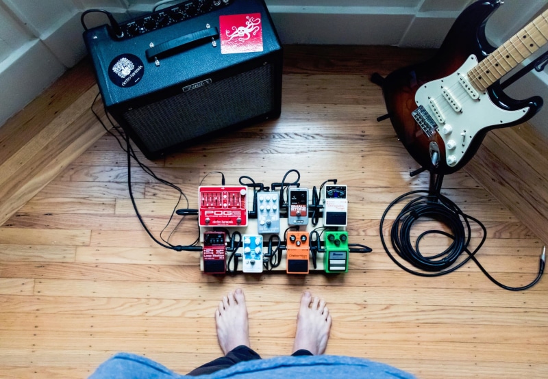 arts culture and entertainment, high angle view, technology, toy, table, hardwood floor, amplifier, electric, indoors, musical instrument, electric guitar