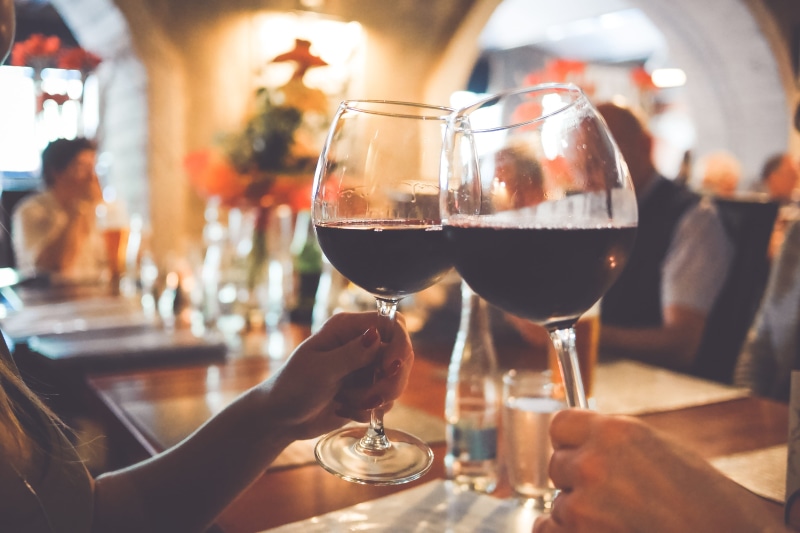 holding, family, friends, human hand, bar - Drink Establishment, birthday, red Wine, focus on foreground, drinking Glass, transparent, human body part