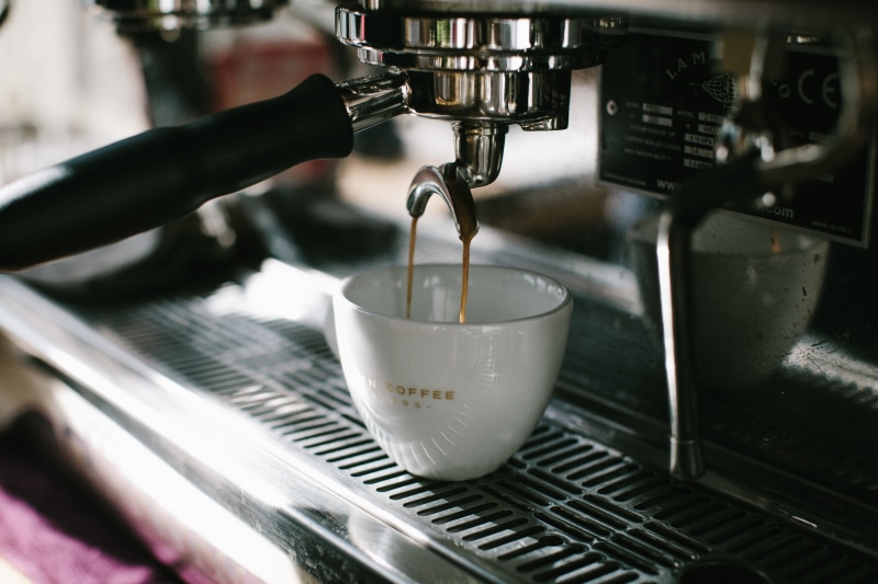 cup, coffee - drink, coffee shop, machinery, white, coffee drink, glass, freshness, pouring, kitchenware, cup of coffee, food and drink, beverage, restaurant