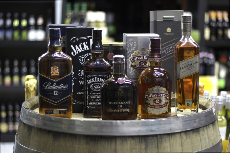 communication, variation, bottle, focus on foreground, drinks, indoors, alcoholic, day, still life, whiskey, food and drink, close-up, container, glass - material