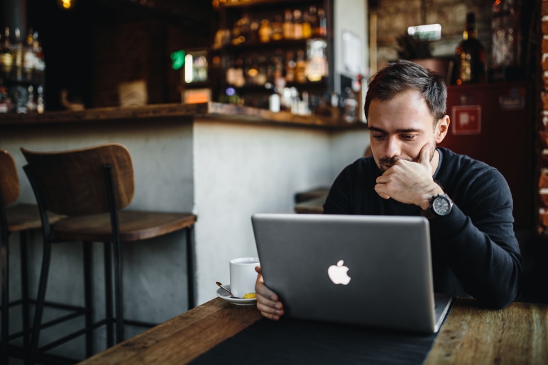 interior, one Man Only, workspace, casual, young, Entrepreneur, contemplation, focus on foreground, macbook, real people, caucasian Ethnicity, sitting