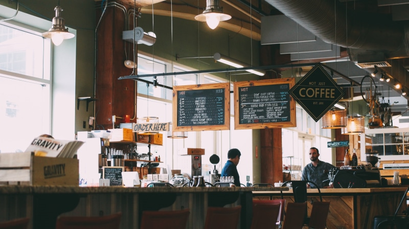 room, real people, men, busy, business, indoors, employees, chair, menu, black, sitting, adults only, group of people, lighting equipment, bar counter