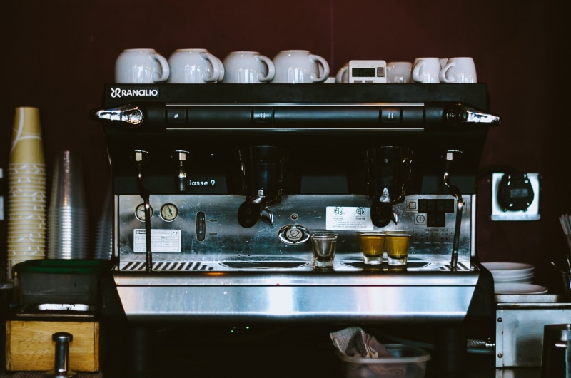 technology, no people, espresso maker, dishes, bar counter, indoors, refreshment, cups, appliance, household equipment, black, drink, kitchen, container