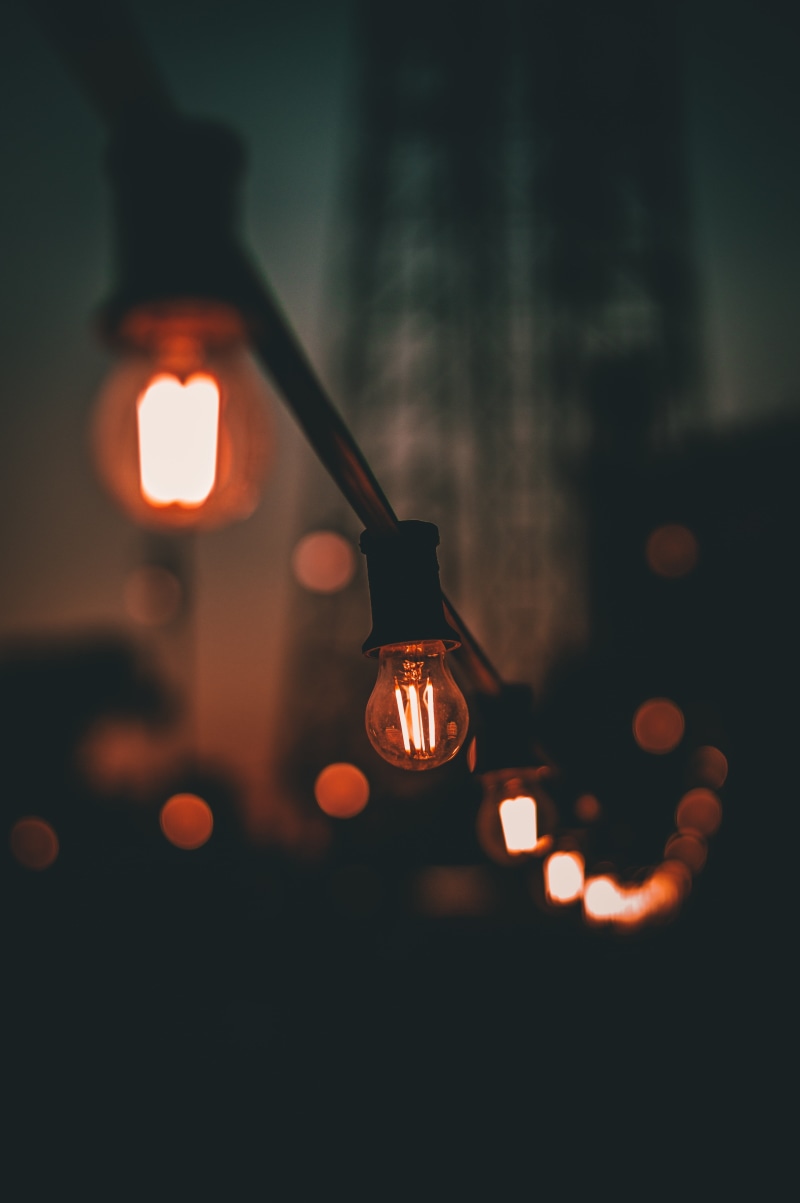 blur, dark, selective focus, lighting, glowing, close-up, focus on foreground, decoration, technology, retro Styled, indoors, chandelier, hanging, transparent