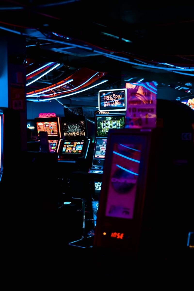close-up, lighting equipment, text, slot machines, dark, architecture, screen, 4K, light, transportation, indoors, leisure activity, arts culture and entertainment