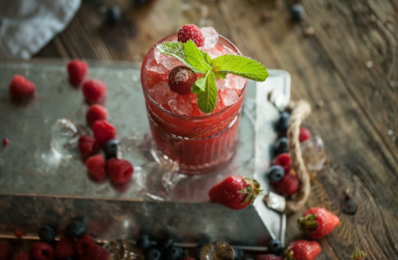 mint leaf - culinary, glass, high angle view, red, ready-to-eat, garnish, close-up, blueberries, drinking glass, leaf, drink, food, herb, healthy eating