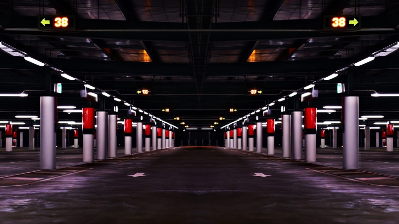 ceiling, underground, red, indoors, direction, sign, parking garage, pillars, architectural column, gray, cement, long, passage, dark, garage, illuminated