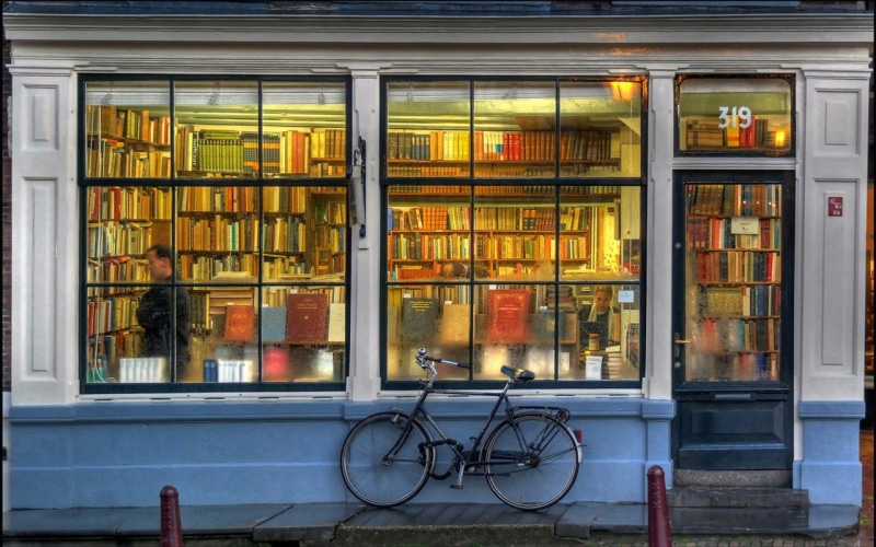 outside, no people, 720P, store, building, hard, transparent, retail, window, stores, bike, library, building exterior, bicycle, built structure, stationary