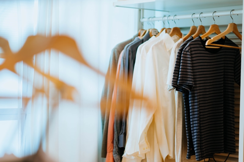 suit, striped, retail, indoors, hanger, dressing room, wardrobe, garment, variation, fashion, shirts, long sleeve, coat, boutique, shop, rack, selective focus