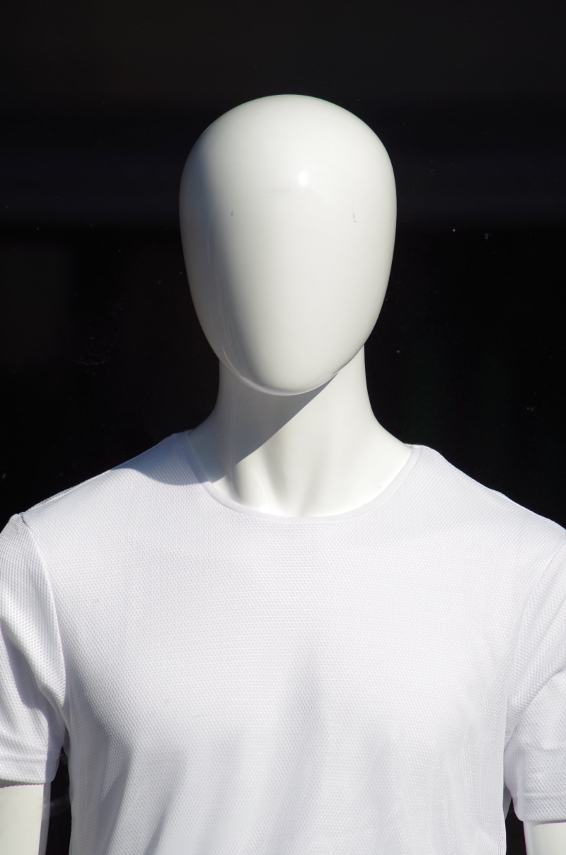 male, t-Shirt, retail display, black background, fashion, people, white, indoors, dummy, retail, focus on foreground, head, textile, garment, consumerism