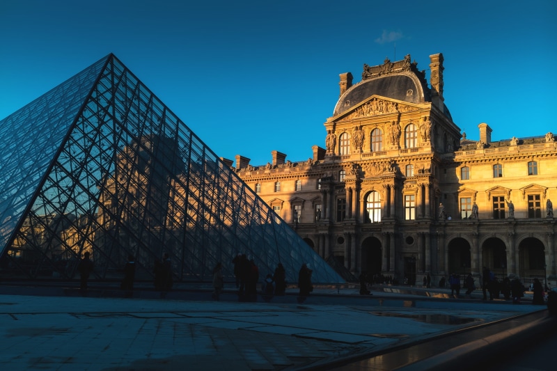 built structure, history, architecture, travel, city, incidental people, pyramid, louvre, museum, tourism, sunlight, travel destinations, tower, clear sky