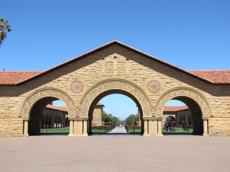 arch, education, blue, usa, religion, courtyard, sky, stanford university, entrance, outdoors, school, degree, campus, landmark, built structure, nature