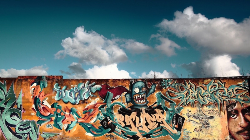 street art, sky, outdoors, mural, built structure, day, berlin wall, representation, creativity, male likeness, multi colored, no people, cloud - sky, Berlin