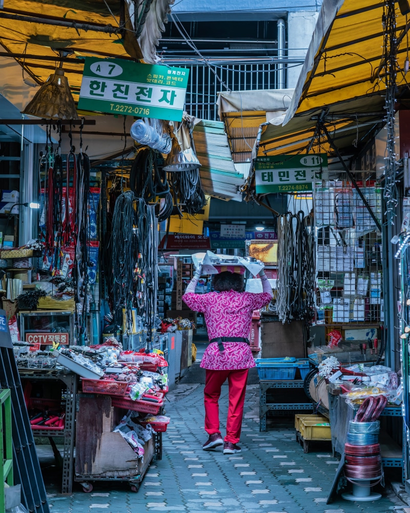retail display, stocks, stand, stall, stock, real people, selling, marketplace, woman, building exterior, bazaar, daylight, pathway, South Korea, industry
