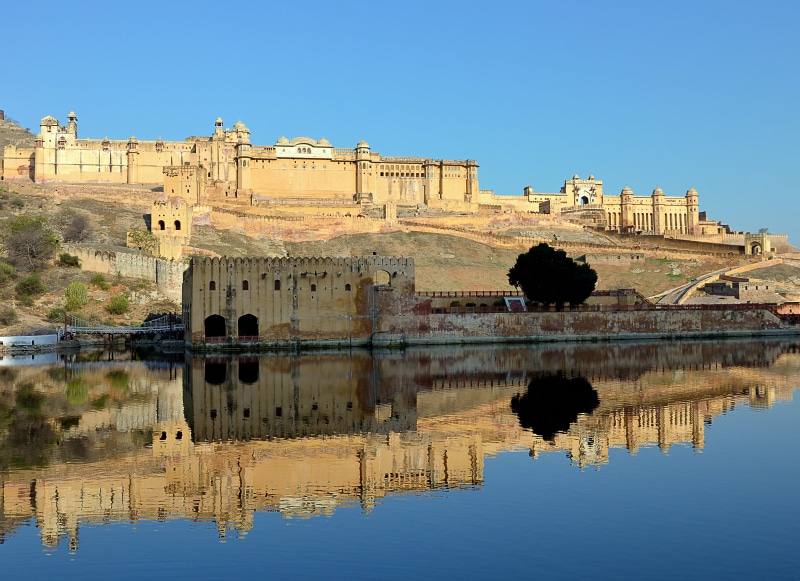 clear sky, reflection, no people, 8K, day, outdoors, ancient civilization, rajasthan, built structure, maotha lake, jaipur, travel, building, waterfront