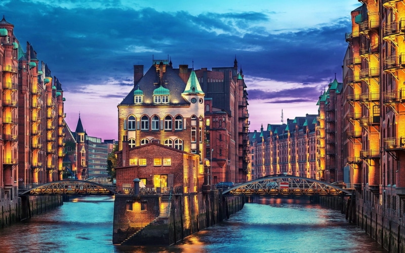 sky, connection, bridge - man made structure, Speicherstadt, canal, water, tower, travel destinations, waterfront, building exterior, river, cloud - sky