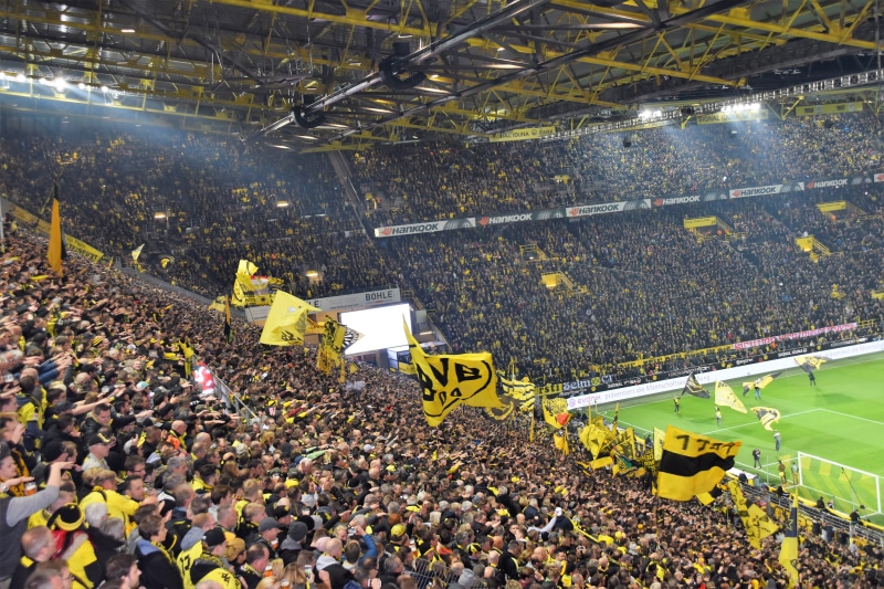 people, soccer, audience, transportation, yellow, stadium, crowd, day, sport, football, real people, emotion, high angle view, beauty in nature, large group of people