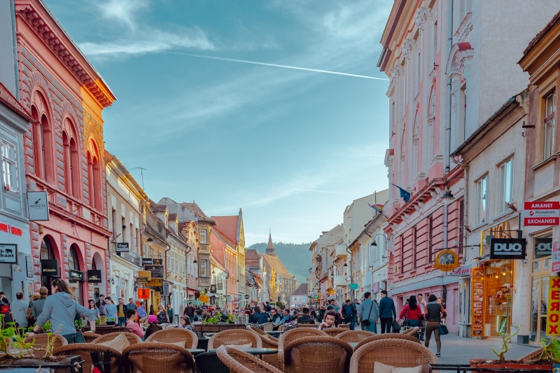 building Exterior, cobblestone, sky, 4K, colorful building, outdoors, europe, european street, square, cityscape, travel, romania, town Square, cafe, city