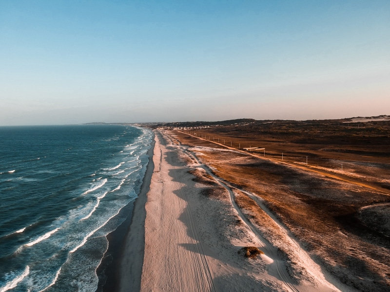 beside, sky, sand, beauty in nature, drone, landscape, ocean green, explore more, aerial, clear sky, copy space, no people, horizon line, outdoors, body