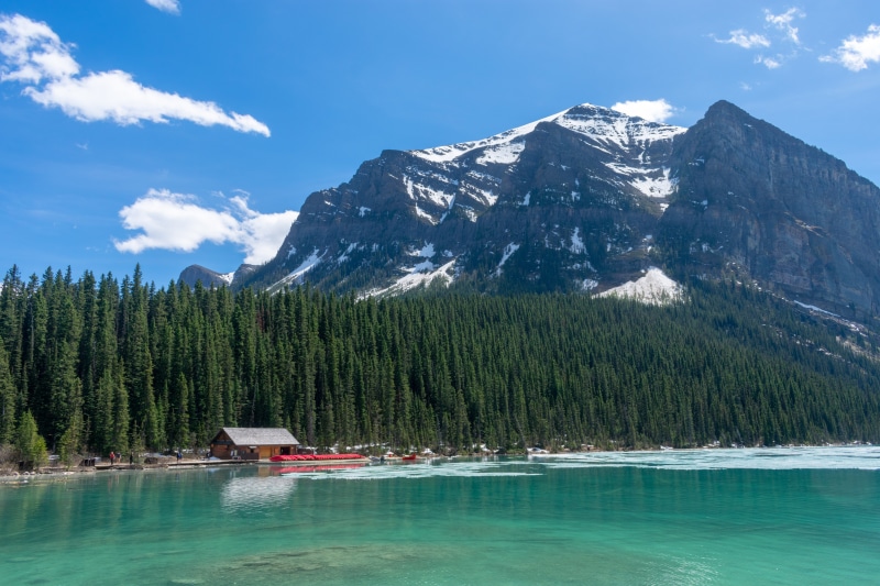 black, non-urban scene, mountain peak, forest, adventure, snow, lake, tranquil scene, surrounding, forest green, beauty in nature, pine, pine tree, greenery