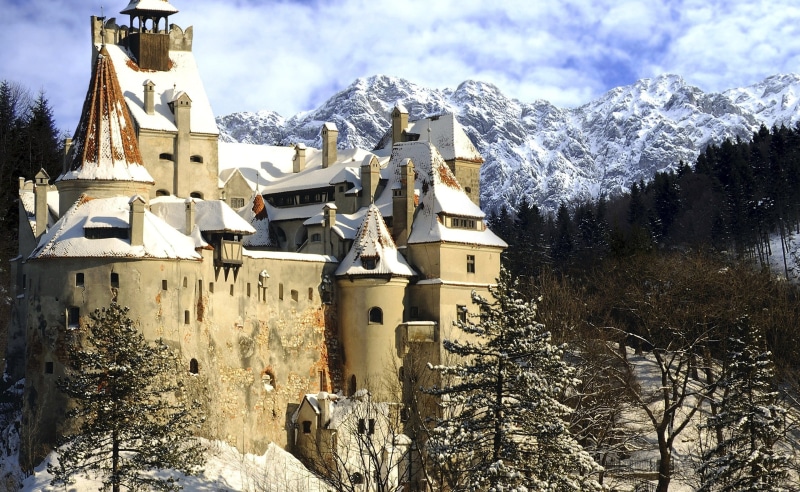 plant, landscape, day, mountain, building, sky, religion, building exterior, castle, mountains, built structure, nature, frozen, snowcapped mountain, outdoors