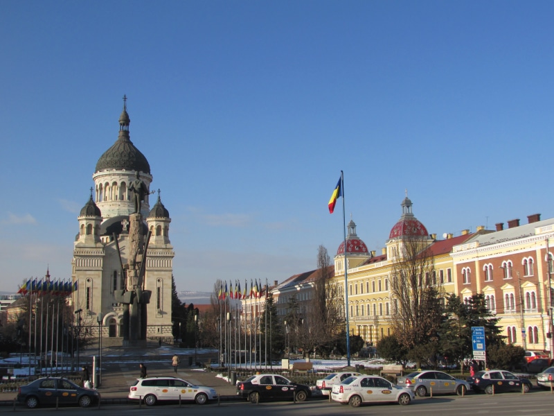 buildings, romania, travel destinations, old, sky, building, government, outdoors, old town, street, transportation, abraham iancu, land vehicle, cluj napoca