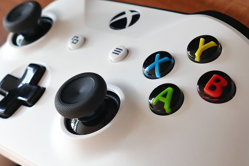joystick, table, high angle view, choice, equipment, variation, medium group of objects, console, xbox, technology, microsoft, 5K, no People, control