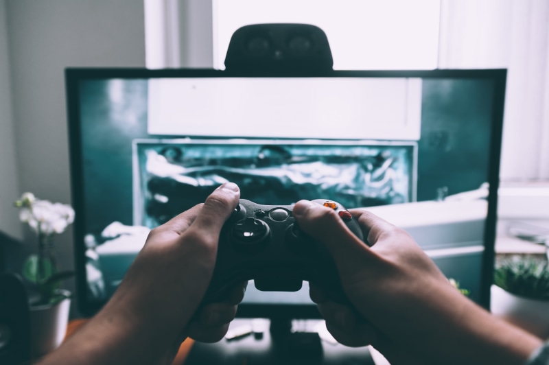 leisure activity, computer, video, indoors, close-up, photography themes, technology, lifestyles, front, play, communication, video game, real people, flat