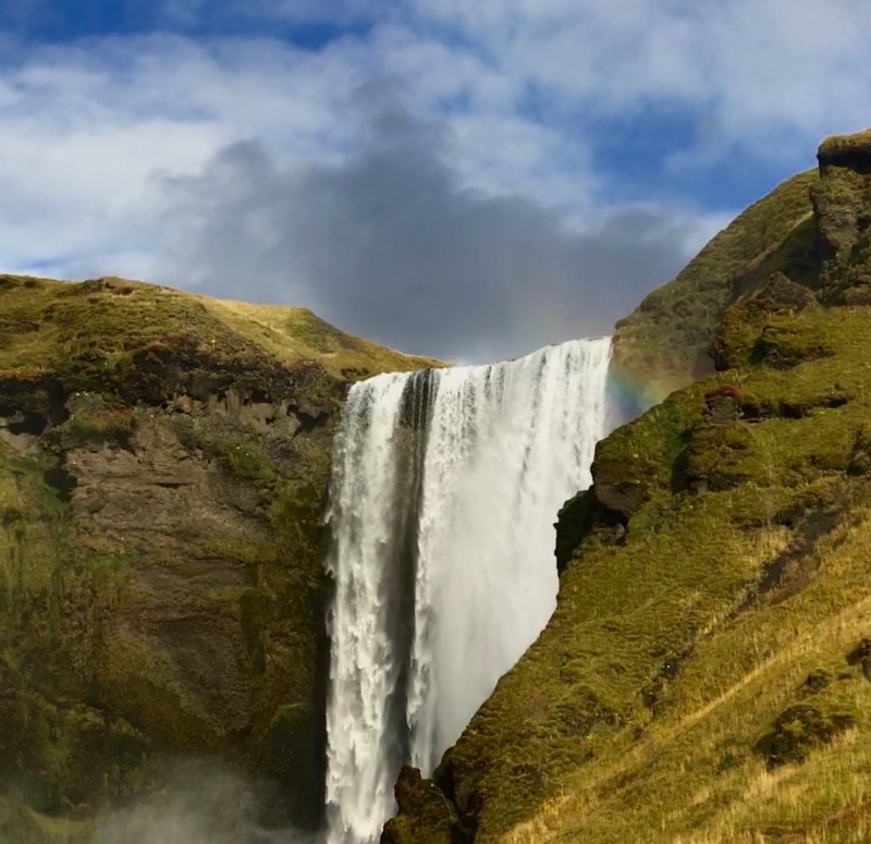 flowing water, 1080P, explore, waterfall, landscape, travel, cloud - sky, rainbow, motion, mountain, environment, blurred motion, land, rock, cliff, skógafoss