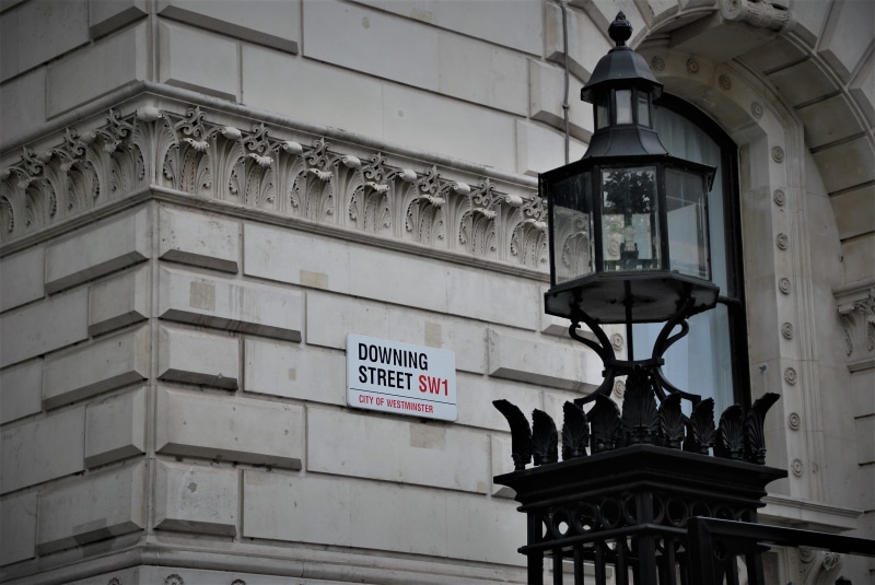 travel destinations, lamp, sign, downing street, history, ornate, turned, the past, communication, wall, architecture, building, wall - building feature
