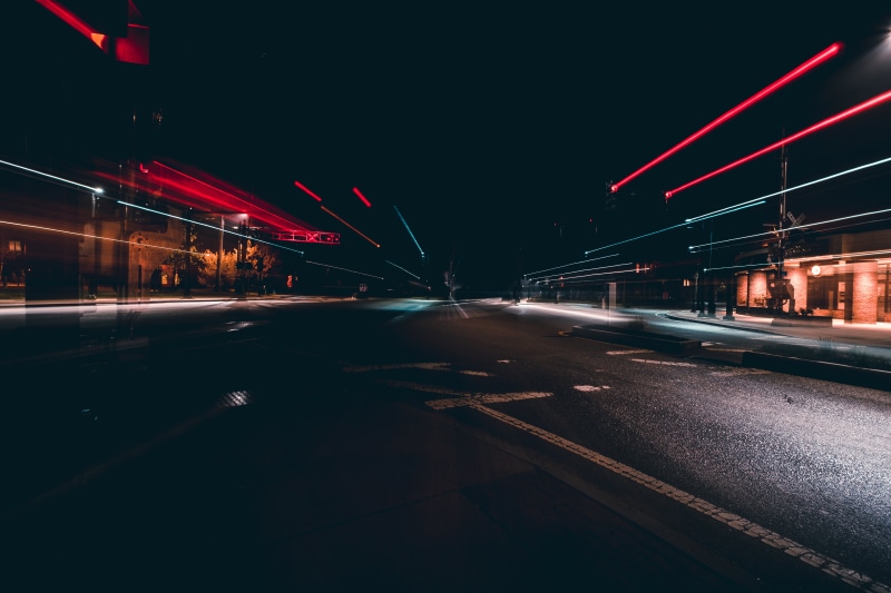 traffic, built structure, night, asphalt, illuminated, outdoors, architecture, car, dusk, buildings, no people, street, mode of transportation, long exposure
