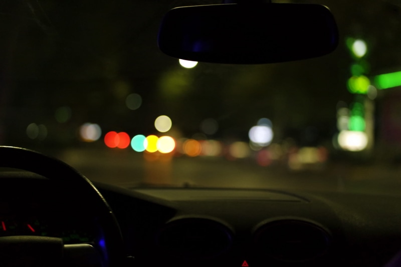 blur, glass - material, travel, dashboard, dark, street, mode of transportation, no people, transparent, windshield, vehicle, motor vehicle, focus on foreground