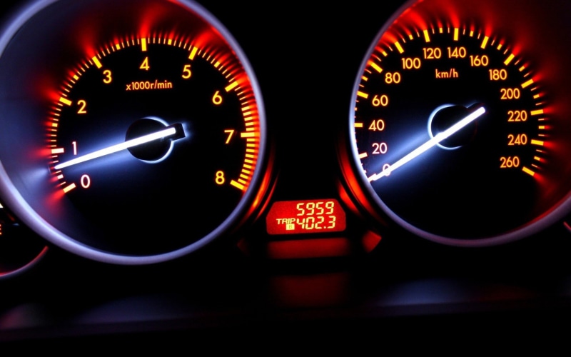 control panel, number, glowing, speed, motor vehicle, land vehicle, no people, tachometer, transportation, control, vehicle interior, speedometer, black background