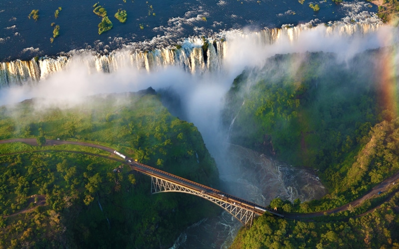 Africa, travel destinations, water, tranquil scene, beauty in nature, scenics - nature, outdoors, iguazo, built structure, non-urban scene, waterfall, mountain