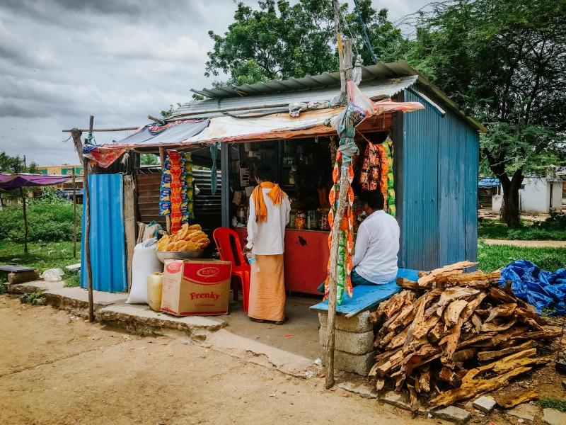 grocery, market, building exterior, village, culture, temporary, street market, real people, poor, built structure, for sale, stall, day, food and drink