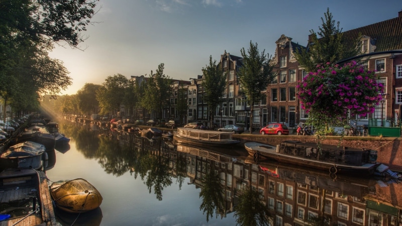building, outdoors, red, no people, sky, waterfront, trees, Netherlands, canal, mode of transportation, tree, plant, residential district, car, nature