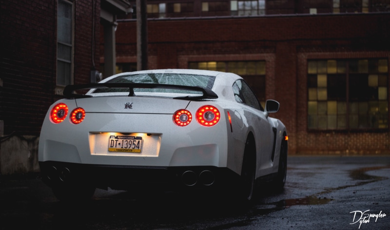 street, sports Car, supercar, built structure, wheel, headlight, gt, speed, compact Car, white, mode of Transport, car, window, garage, urban Scene, city