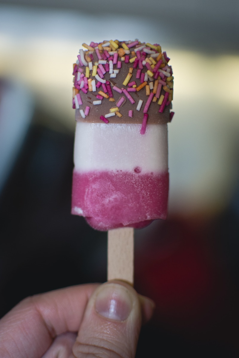 5K, unhealthy eating, indulgence, sweet, dessert, freshness, ice Cream, Popsicle, aircraft, focus on foreground, food, one person, stick - Plant Part