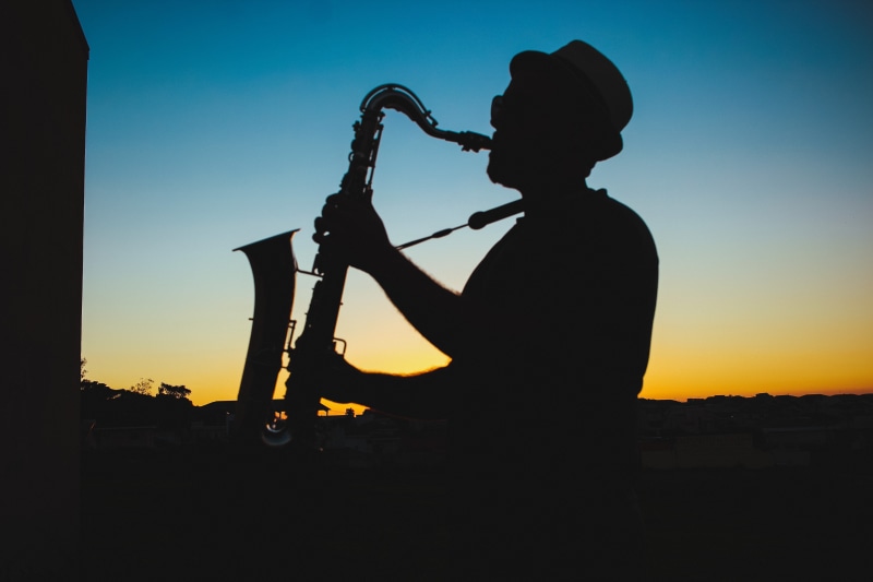 waist up, travel, one person, sky, playing, side view, man, back lit, landscape, person, music, profile, saxophone, dusk, musical instrument, shadow, males