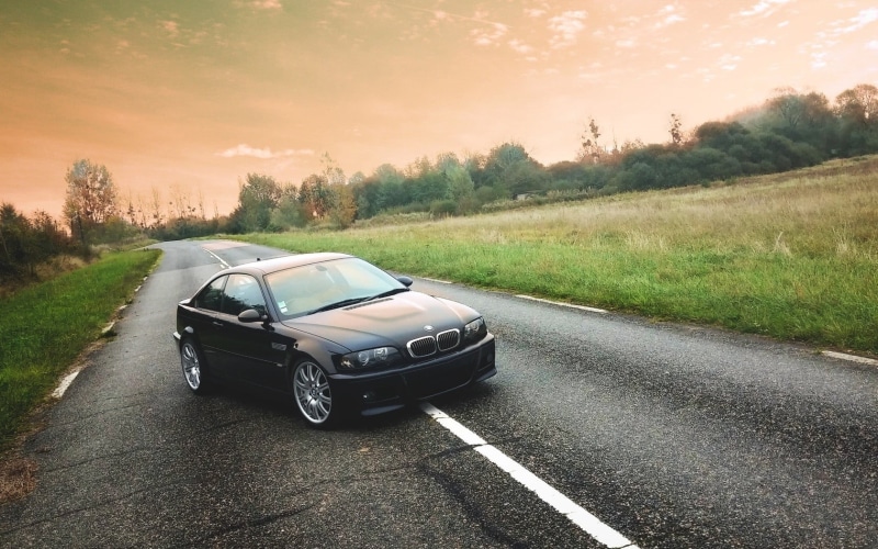 BMW, transportation, direction, mode of transportation, sky, nature, road trip, outdoors, land vehicle, grass, environment, plant, city, road, e46, country