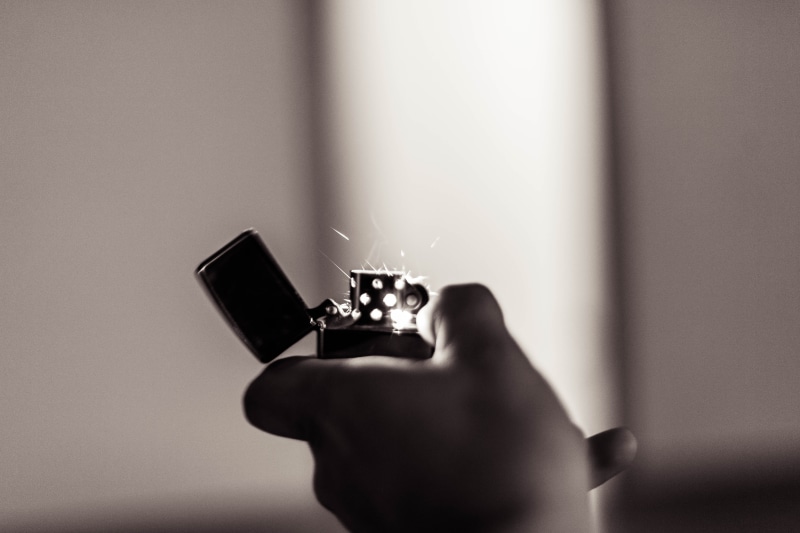 copy space, sparks, motion, lighter, technology, communication, indoors, body part, ring, holding, one person, action, fire, 5K, engagement ring, jewelry