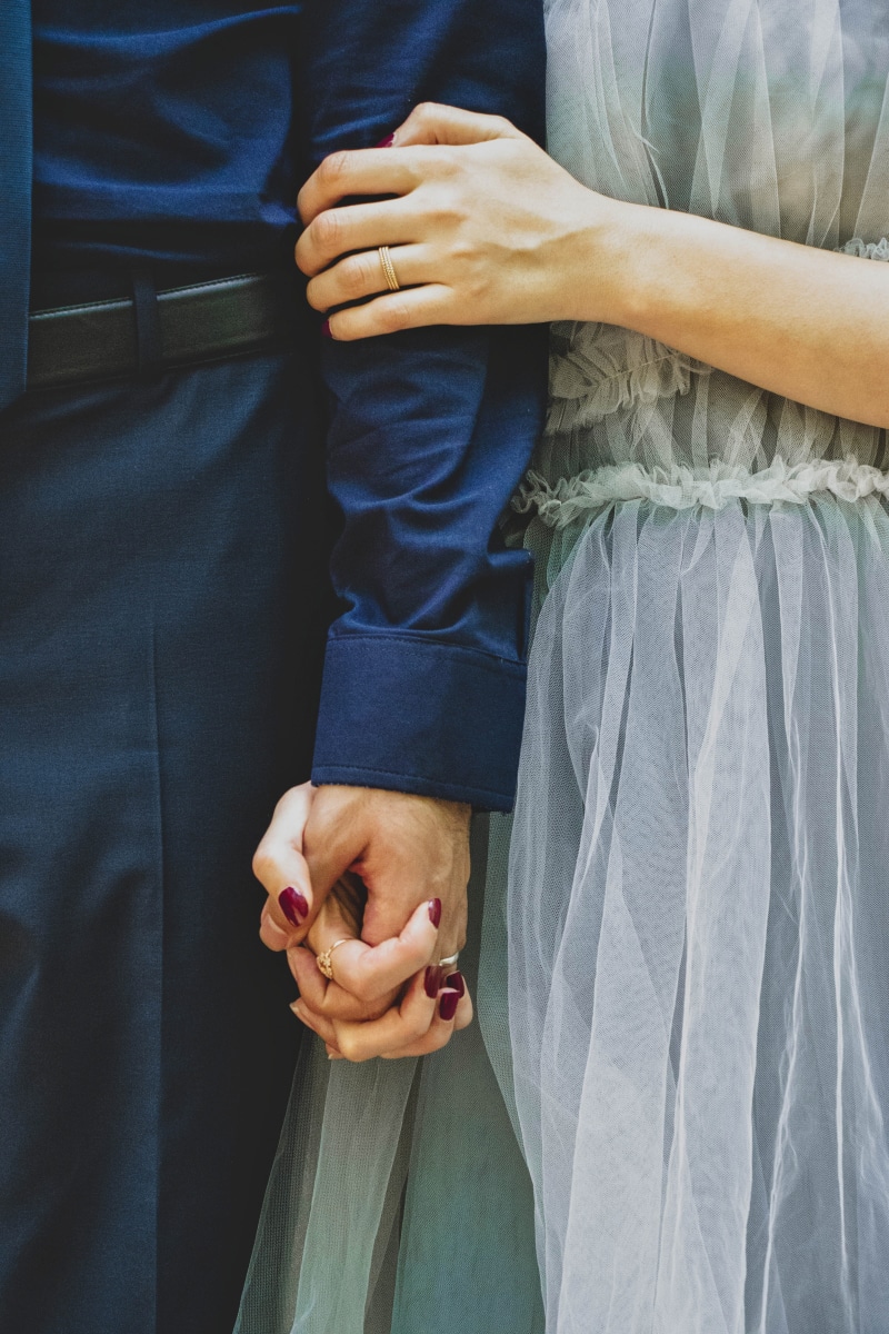 woman, adult, apparel, human, women, holding, goals, clothing, positive emotion, accessories, love, two people, couple, lifestyles, finger, deep blue, hand