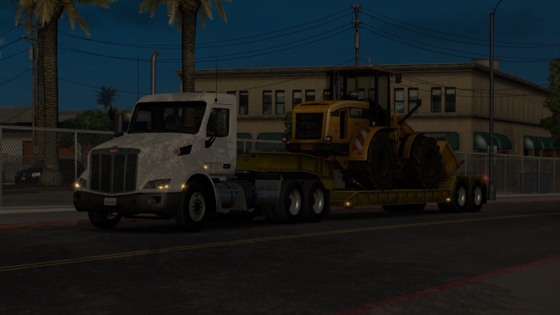 motor vehicle, no people, city, trucks, Peterbilt, mode of transportation, commercial land vehicle, nature, built structure, truck, land vehicle, transportation