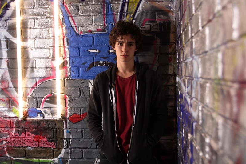standing, s, young Adult, 1080P, brick, factory, white, adolescence, looking at camera, males, industry, hairstyle, indoors, graffiti, nyasha, hoodie