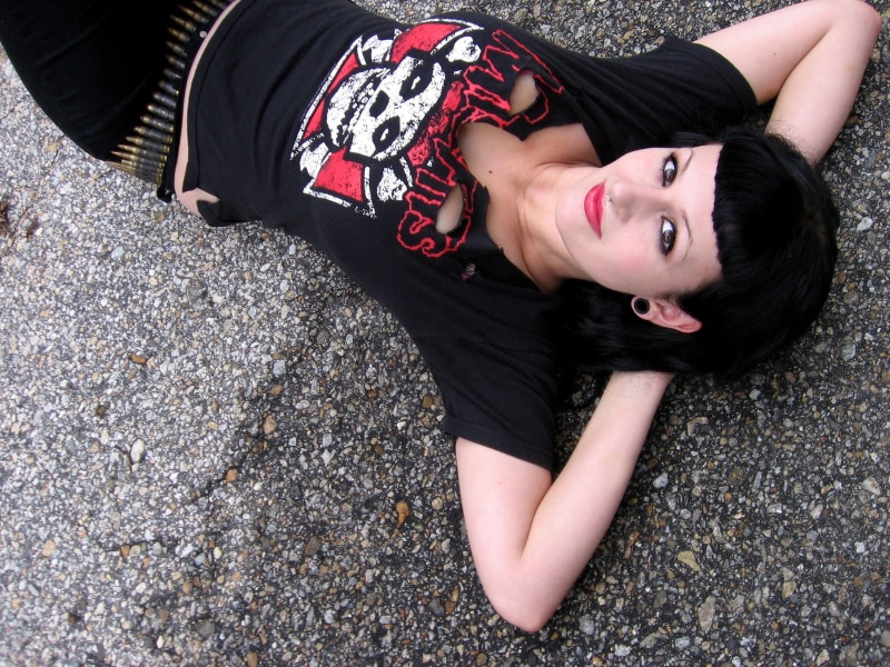 1080P, pin up, black color, asphalt, misfits, front view, hairstyle, lying on back, young adult, woman, day, young women, punk rocker, lying, casual clothing