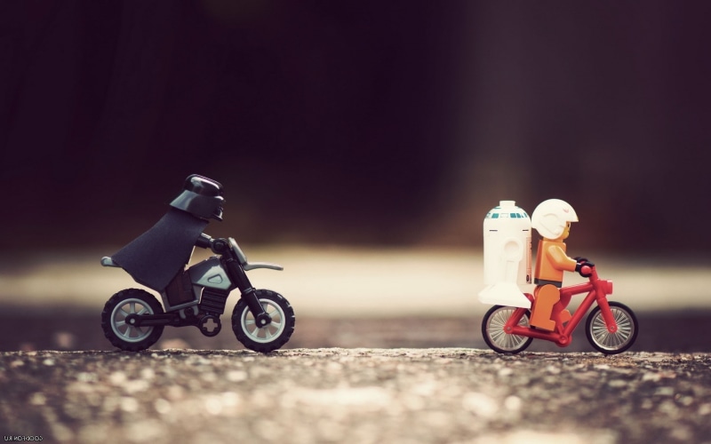 toy, motion, riding, Star, darth, vader, droids, transportation, sports helmet, two objects, men, funny, small, two people, headwear, ride, bicycles, Wars