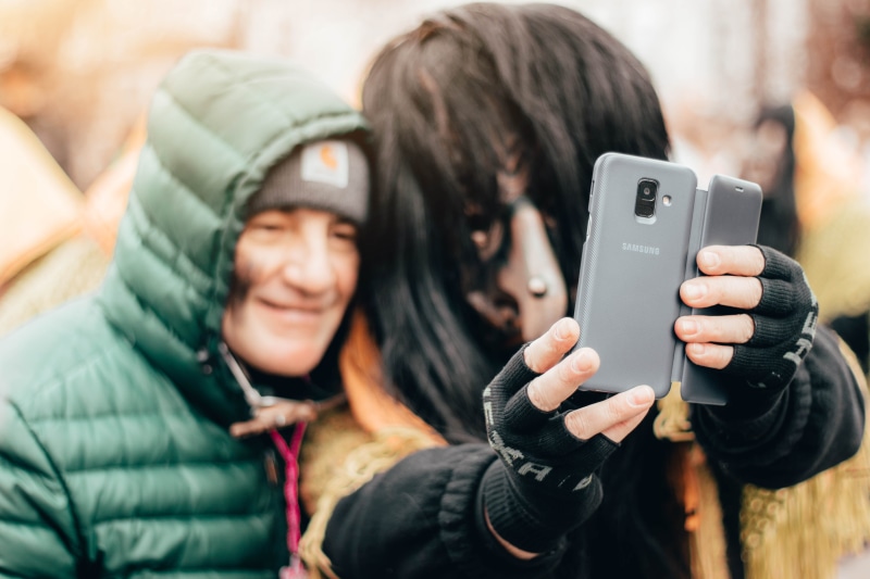clothing, real people, technology, using phone, samsung galaxy s9, selfie, young adult, photo, smiling, warm clothing, human, telephone, smile, communication
