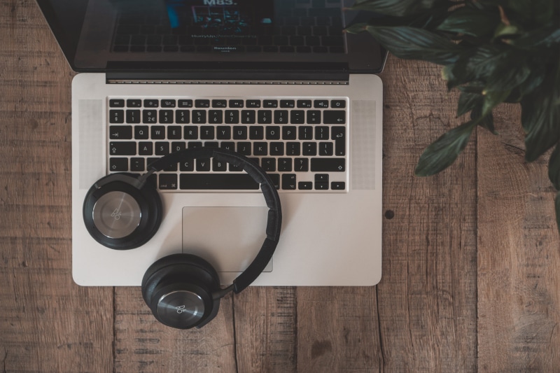 portable information device, flooring, macbook, workspace, computer key, wireless technology, no people, top, headphone, computer keyboard, houseplant