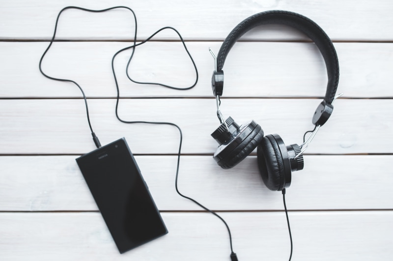 table, communication, no people, white color, cable, technology, flooring, electricity, headphones, listening, indoors, tiled floor, vintage, black color